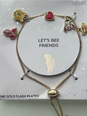Disney Gold Tone Winnie the Pooh Charm Bracelet with Red & Pink Accents